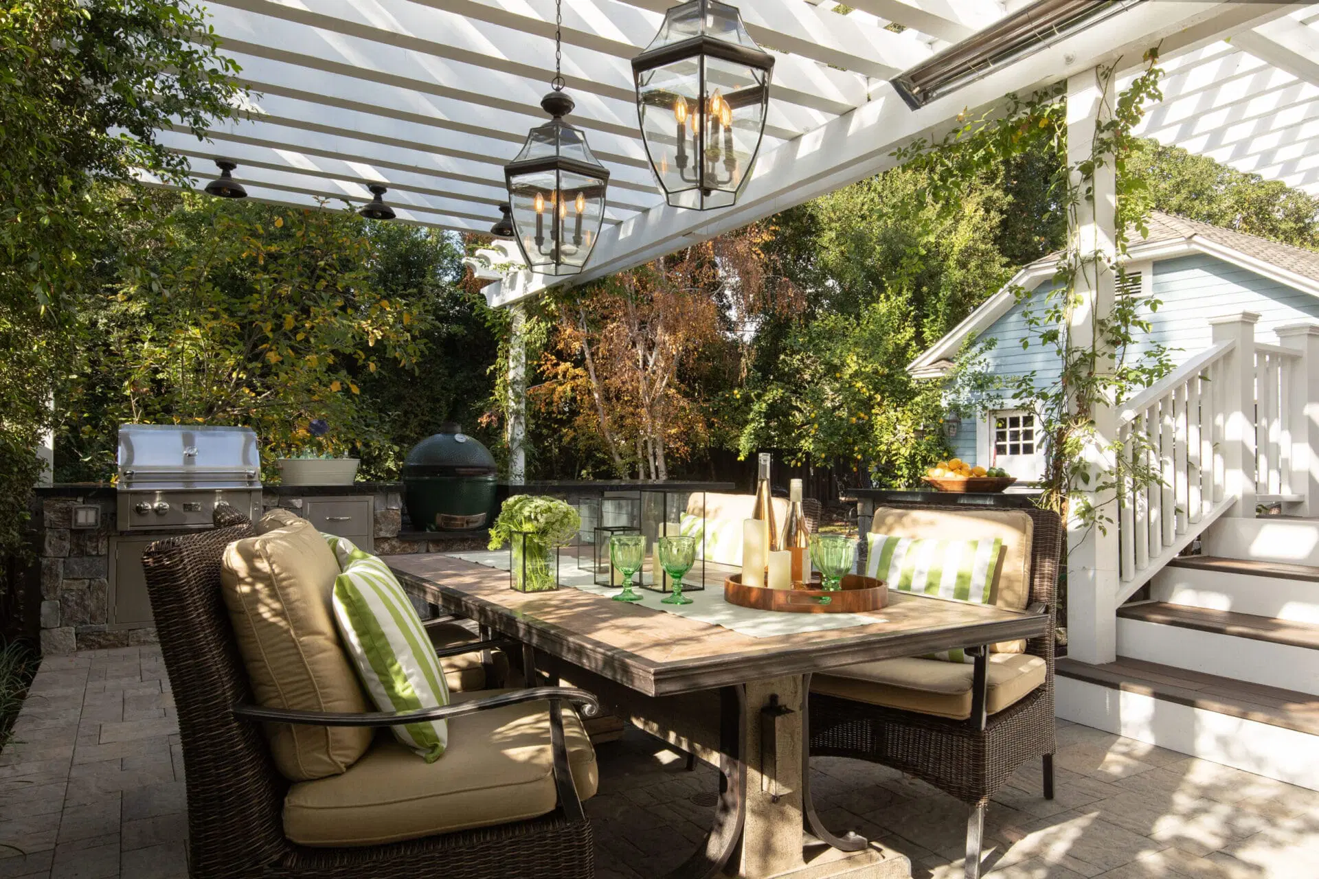 Small deck with maximum decorating impact thanks to lush plants and cozy pillows.